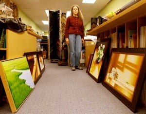 Beth Flor checks out her collection of paintings for her opening Friday in Miele Gallery. Photo/Angela Denning