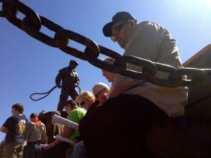 Neil and Margaret Newlun bow their heads in prayer during the ceremony. Photo/Angela Denning
