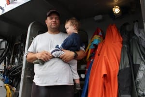 Joe Cisney and his son on a purse seiner