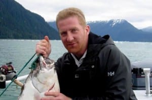Dennis Moore holds a halibut. 