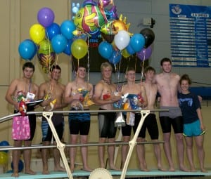 Seniors swimmers are recognized at the home meet. (L-R): Nico Larson, Aaron Murph, Nels Evens, Evan Marsh, Skipper Erickson, Ian Fleming, Abel Aulbach, and Shalie Dahl (Manager).  Most of the senior swimmers have been swimming for Viking Swim Club for 12 years. Photo/Ginger Evens