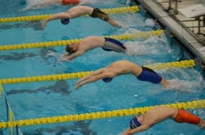 Evan Marsh begins his100 yard backstroke event, which he finished in second place. Photo/Doug Fleming