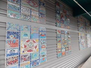 Student artwork adorns the new metal siding on the Rae C. Stedman elementary school. (KFSK file photo)