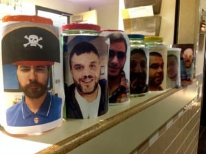 Voting jars sit depicting school participants in Brovember. Photo/Angela Denning