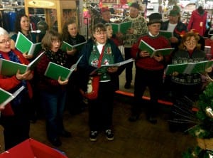 The Oxford Carolers perform Christmas songs upstairs at the Trading Union. Photo/Angela Denning