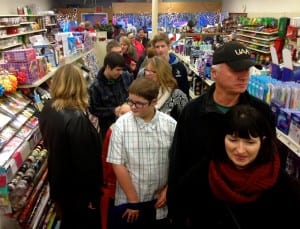 People wait in line inside the Rexall Drugstore on Christmas Eve. Photo/Angela Denning