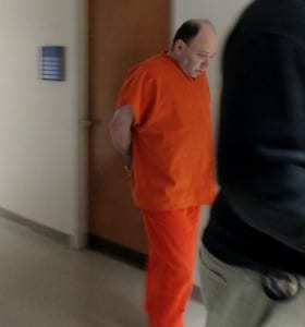 Tye Leif Petersen is escorted by U.S. Marshals to his sentencing hearing on child pornography charges in Juneau on Jan. 7, 2015. (Photo by Matt Miller/KTOO)