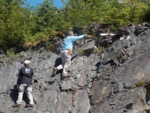 Federal agents inspected a piece of plastic pipe at Petersburg's rock pit in July. (KFSK file photo)