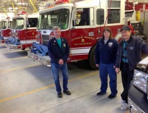 Volunteer Fire Chief Doug Welde, Fire and EMS Director, Sandy Dixson, and Volunteer Assistant Fire Chief, David Berg stand in the Fire Hall's apparatus bay. Photo/Angela Denning