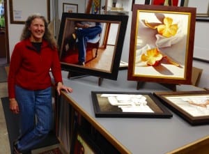 Beth Flor stands with a few paintings in her art show at Miele Gallery. Photo/Angela Denning