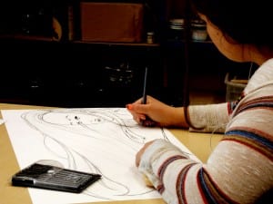 Joec Randolph works on a drawing in art class. Photo/Rosa Lopez