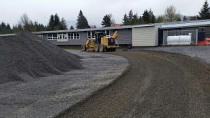Borough workers smooth out a new gravel track, April 27. Photo/Brad Taylor