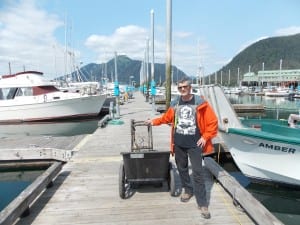 Ed Crawford stands by his crab pot in middle harbor. photo//Joe Sykes