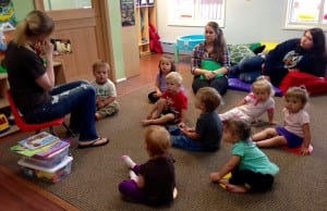 Teacher Theressa Phillips reads to the toddler class with Assistant teacher, Brina Compton and teen worker, Kallie Caples looking on. Photo/Angela Denning