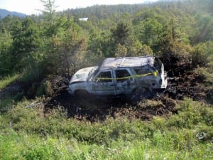 The car is believed to have gone off the road prior to being set on fire. Photo courtesy of the Alaska Wildlife Troopers