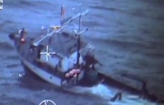 Coast guard rescues four from sinking tender