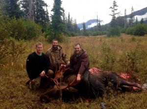 Wrangell hunters Dave Brown, James Leslie and Jeffry Davidson pose with the legal moose Davidson killed up the Stikine River this year. Photo courtesy of Peter White