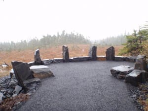 This the final rest area of the new section of the Ravens Roost Trail at the top of the muskeg where it joins the old trail. There is a wooden bench and stone benches there. Photo/USFS