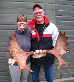 Petersburg residents Tessa Bergmann and her father William display antlers from William's moose harvested in September. (Photo courtesy of Rich Lowell ADFG)