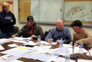 (left to right) Harbor Master Glorianne Wollen, Charles Davis, Dick Somerville, and Bob Dolan talk about the details of the Bulkhead Loading Dock. Photo/Angela Denning