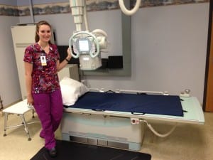 Radiologic Technologist Sonja Ewing stands with the new x ray machine. Photo/Angela Denning