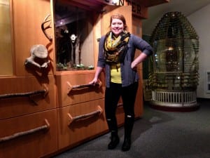 Brittany Zenge stands next to the Discovery Center exhibit in the Clausen Museum. Photo/Angela Denning