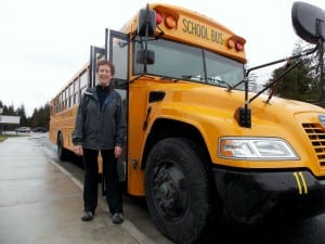 Hoopie Davidson stands near the Petersburg School District's new 2106 Bluebird school bus. Photo/Angela Denning