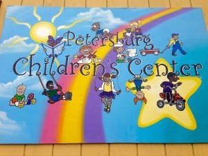 This bright sign hangs outside the Children's Center building. Photo/Angela Denning