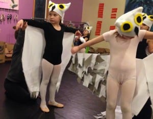 First grader, Fyscher Humpfry, tries on her snow owl costume for the first time. Photo/Angela Denning