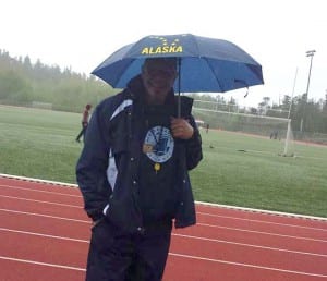 Coach Brad Taylor tries to stay dry at the Ketchikan track meet. Photo/Debyy Eddy