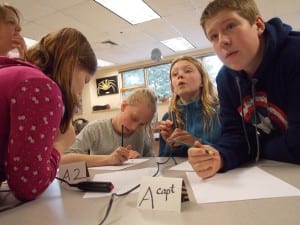 Middle School students try to figure out a marine science question while practicing a science bowl trivia game. (L-R) Elizabeth Stewart, Rose Lane, Evelyn Anderson, Bergen Kludt-Painter, Sean Spigelmyer. Photo/Angela Denning
