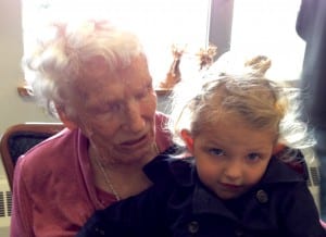 Tora Thynes holds her two-year-old great-granddaughter, Maya, during her 91st birthday party. Photo/Angela Denning