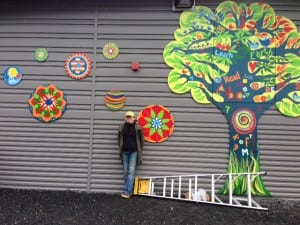 Artist Pia Reilly stands with some of the paintings she created for the Rae C. Stedman Elementary School. Photo/Angela Denning