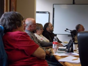 Assembly members Nancy Strand, mayor Mark Jensen, Cindi Lagoudakis and Kurt Wohlhueter listen to testimony Monday.