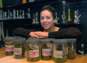 Danielle Baldwin shows off strains of medical marijuana at a smoke shop in Ashland, Oregon. AP Photo/Jeff Barnard