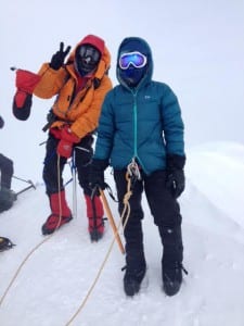 Henderson and a fellow climber at the summit (photo courtesy of Angela Henderson)