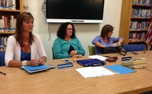 Superintendent Erica Kludt-Painter sits with school board members Cheryl File and Sarah Holmgrain at a meeting Aug. 9, 2016