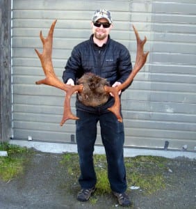 Bjorn Stolpe of Petersburg stands with the antlers of his legal moose taken near Pt. Agassiz. Photo courtesy of Rich Lowell