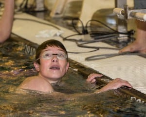 Freshman Peter Kowalski looks at clock during a recent home meet. Photo/Tanya Somerville,www.SeaprintsPhotography.com