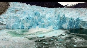 An ice chunk falling of Leconte Glacier causes a huge splash. Photo/Elliot Nash