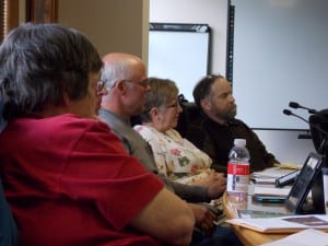 Kurt Wohlhueter (far right) listens to public opinion during an assembly meeting.  