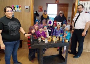 Preschoolers with Good Beginnings bring donated food to the Salvation Army Church, Nov. 21. The church is run by John and Mysti Birks. Photo/Angela Denning