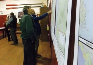Petersburg resident, Jeff Meucci, points to a lands map while Ed Wood looks on. Photo/Angela Denning