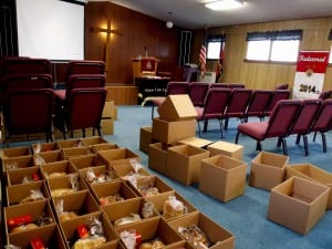 Boxes of Thanksgiving food are organized in the Salvation Army Church before being distributed to needy families. Photo/Angela Denning