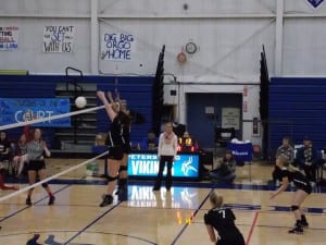 Tanya Spears and Emma Chase block a shot against Wrangell Friday night.