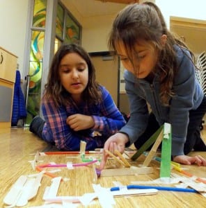 Patton Gonzalez, 10, helps younger students construct a ramp for their Hex Bug. Photo/Angela Denning