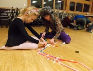 Friends work together to construct mazes with straws and popsicle sticks at Curiosity Creates at the Petersburg Public Library. Photo/Angela Denning