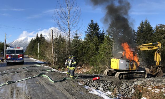 Petersburg volunteer fire fighters respond to a excavator on fire