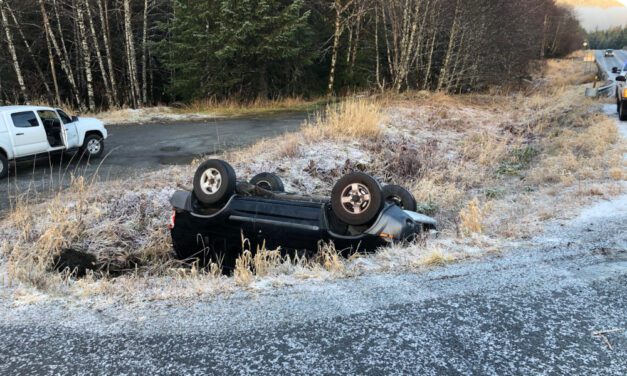 SUV slides off icy roadway