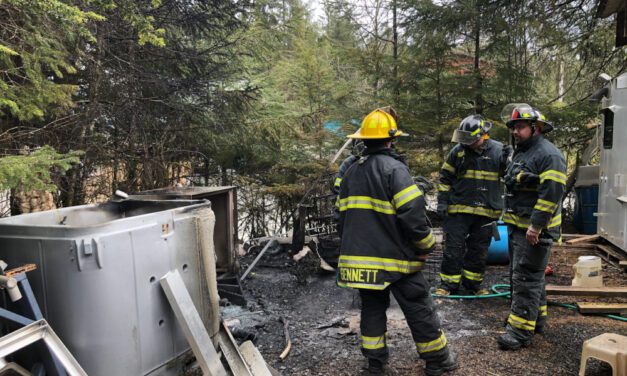 Homeowners douse fire behind Sandy Beach Road home